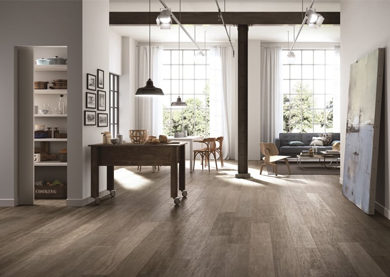 A living room with wood look ceramic tile