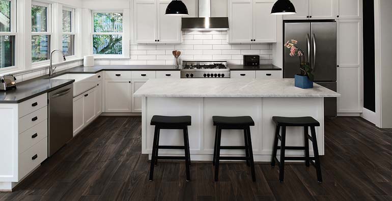 Florida Tile Excursion color Badlands porcelain wood-look tiles installed on a kitchen floor