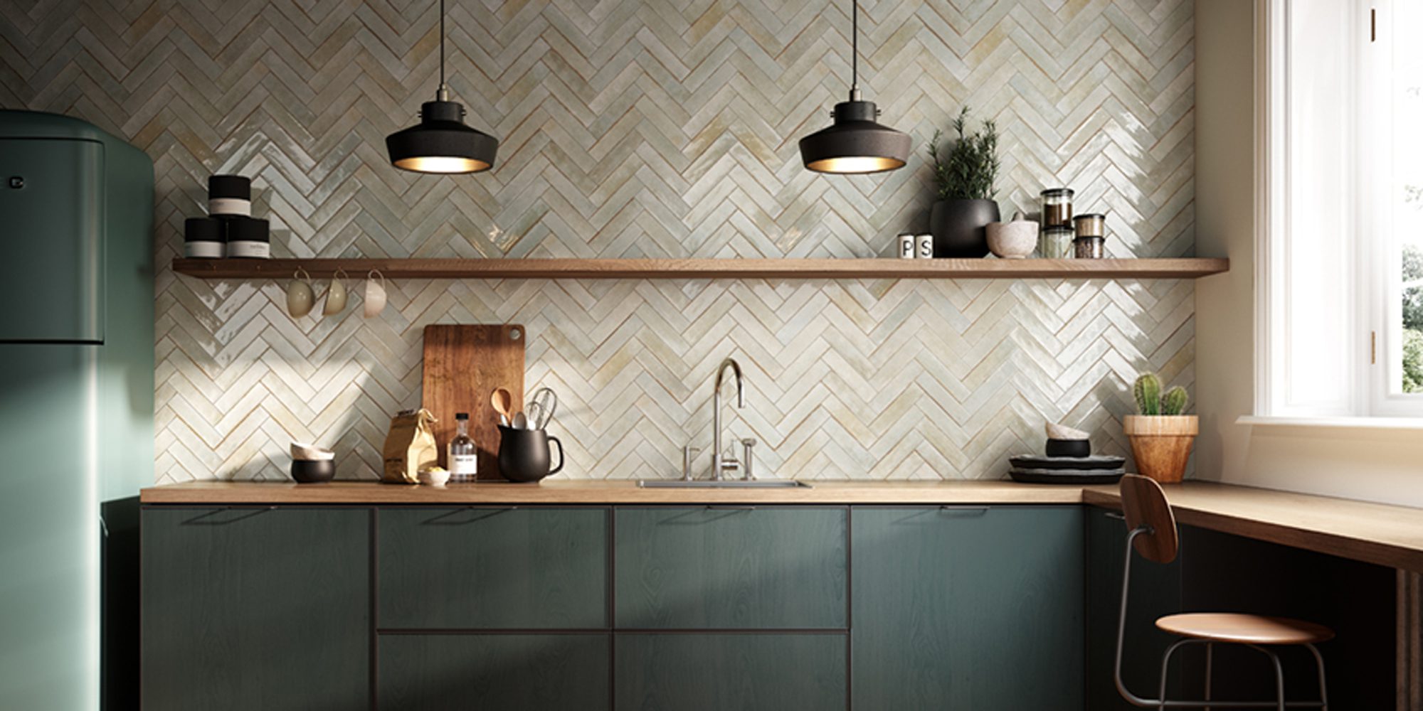 Concerti Chelsea Sage installed in a herringbone pattern on a backsplash.