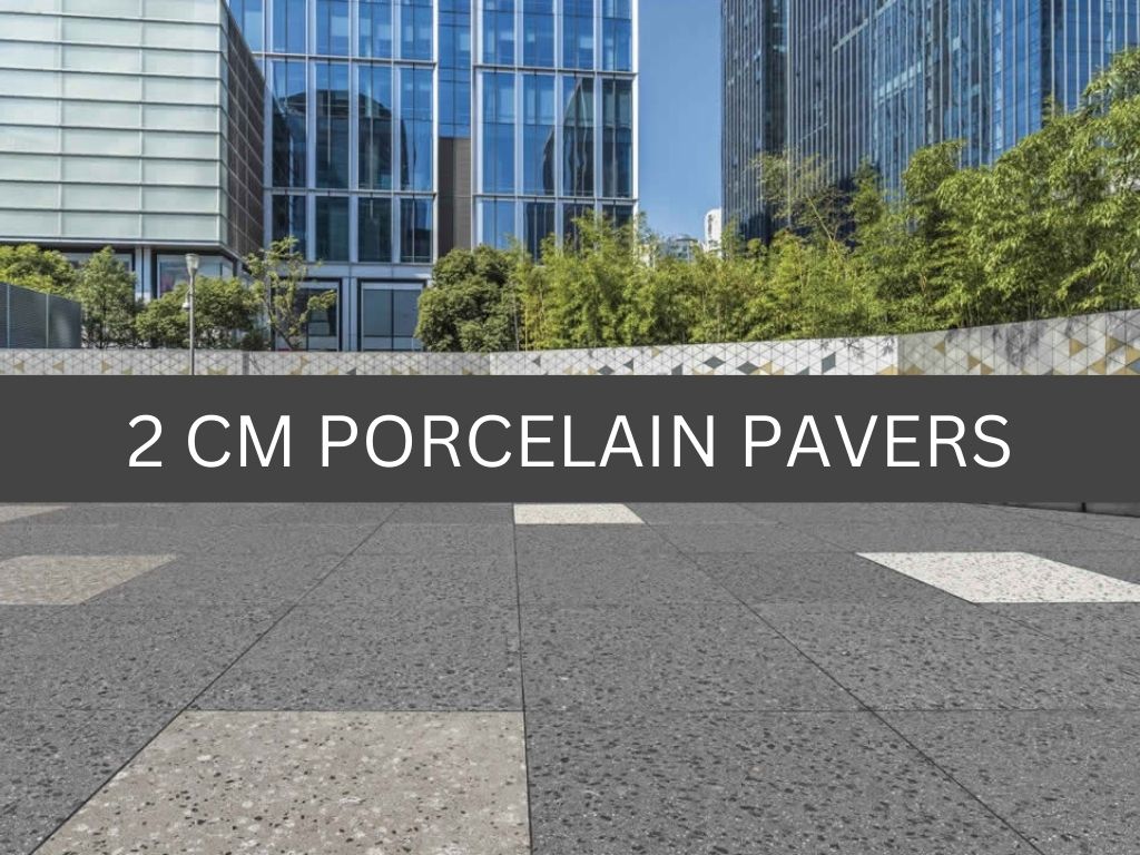 Outdoor promenade featuring multicolor terrazzo style porcelain pavers. Labeled "2 CM Porcelain Pavers".