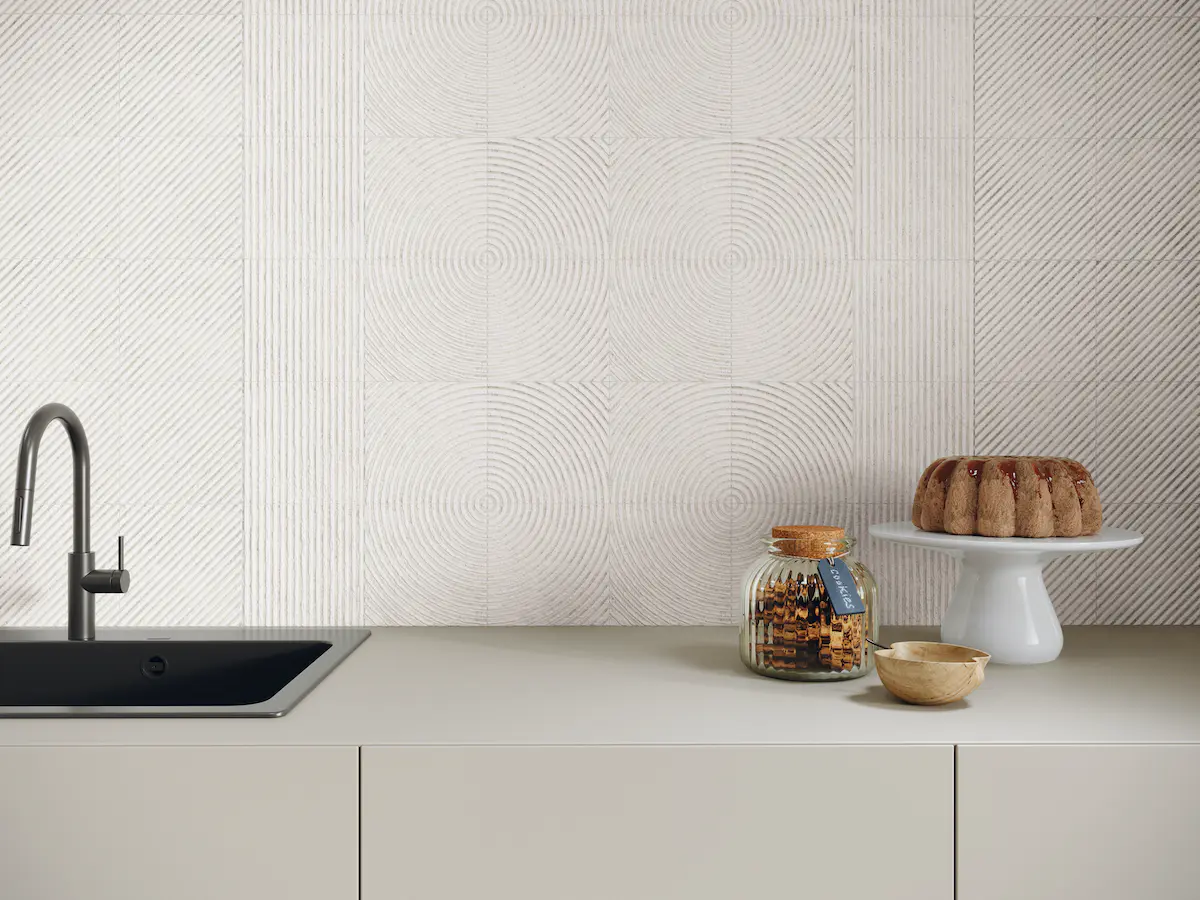 A kitchen backsplash textured accent wall using Gesso White natural stone