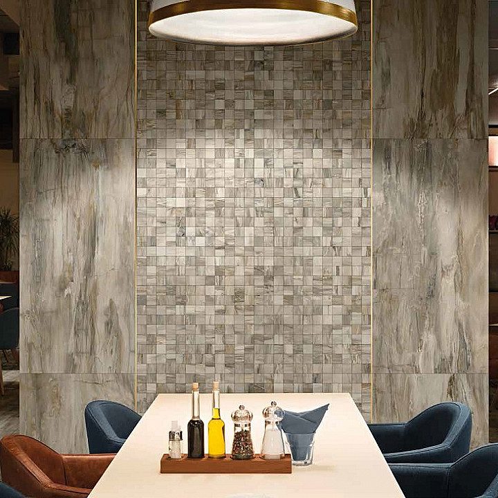 A restaurant booth or amenity space with Mariner Petrified Wood tile installed on the walls.