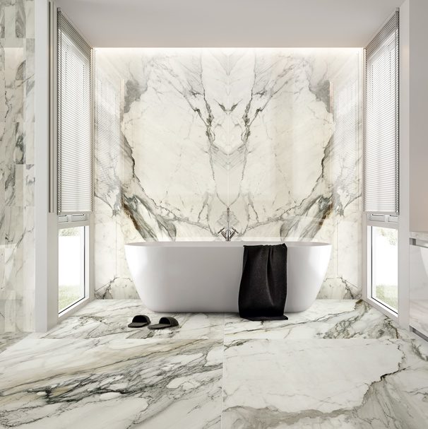 Beautiful bathroom with white bath tub and luxurious porcelain tile that looks like marble